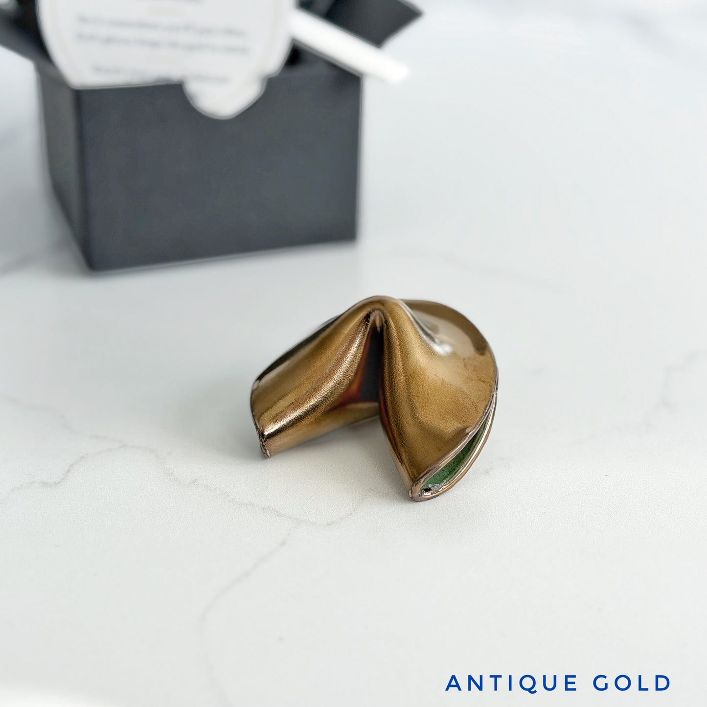 Antique gold ceramic fortune cookie, handmade and glazed by hand in Wilmington, NC by Kathleen Kalish Ceramics.